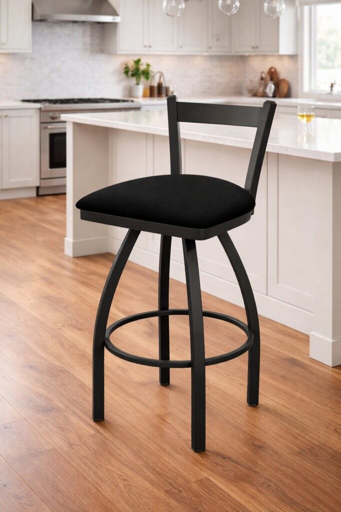 Black counter height bar stool with cushioned seat and metal frame in modern kitchen